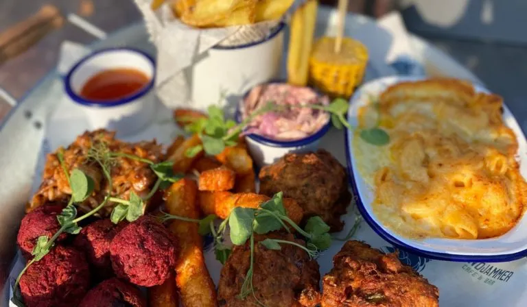 A sharing platter at Windjammer Cafe in Falmouth: pulled pork, beetroot falafel, mac and cheese, chunky chips, sweetcorn and slaw.