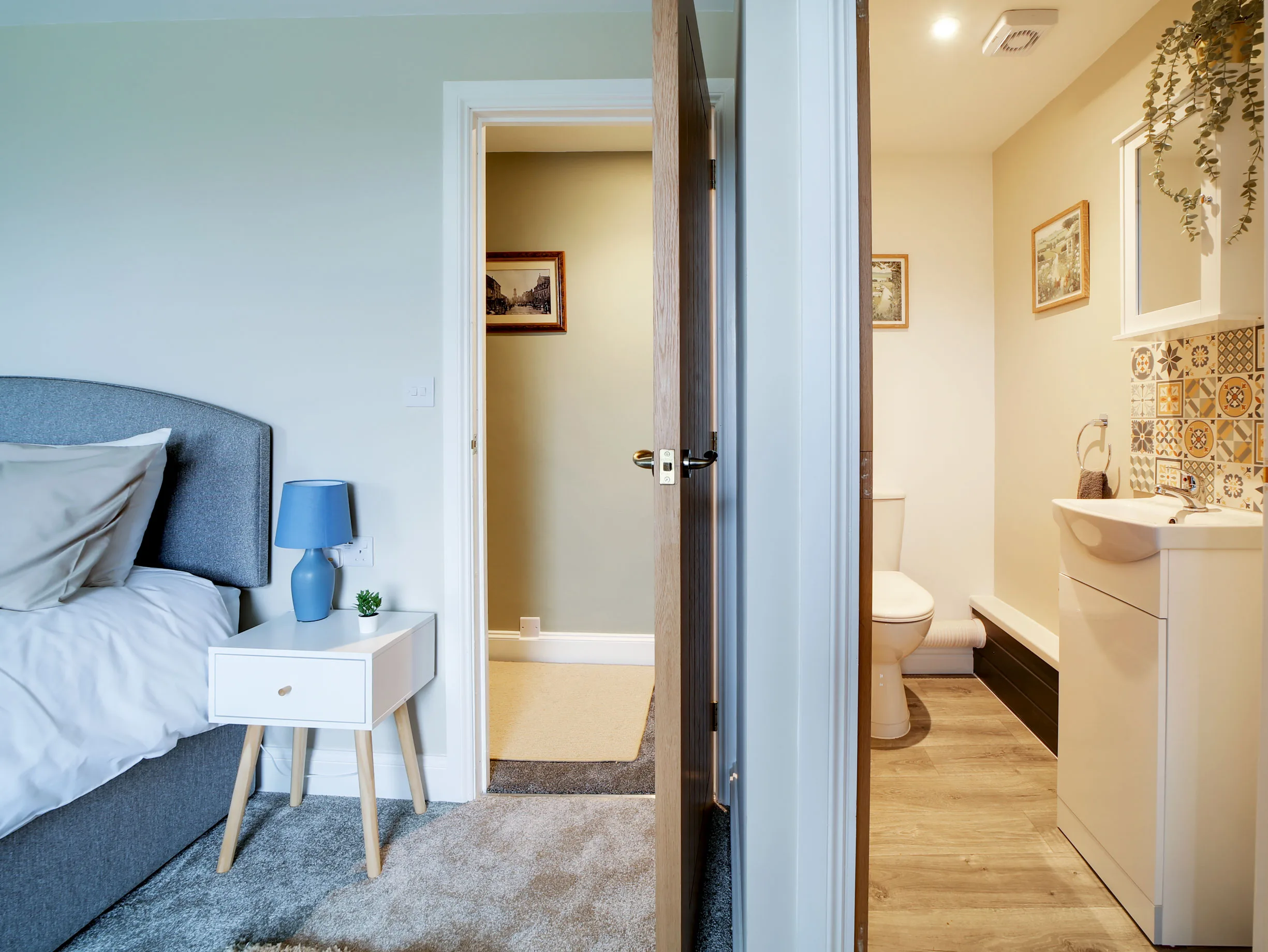 Little Avalon bedroom with doors to the small upstairs en-suite WC.