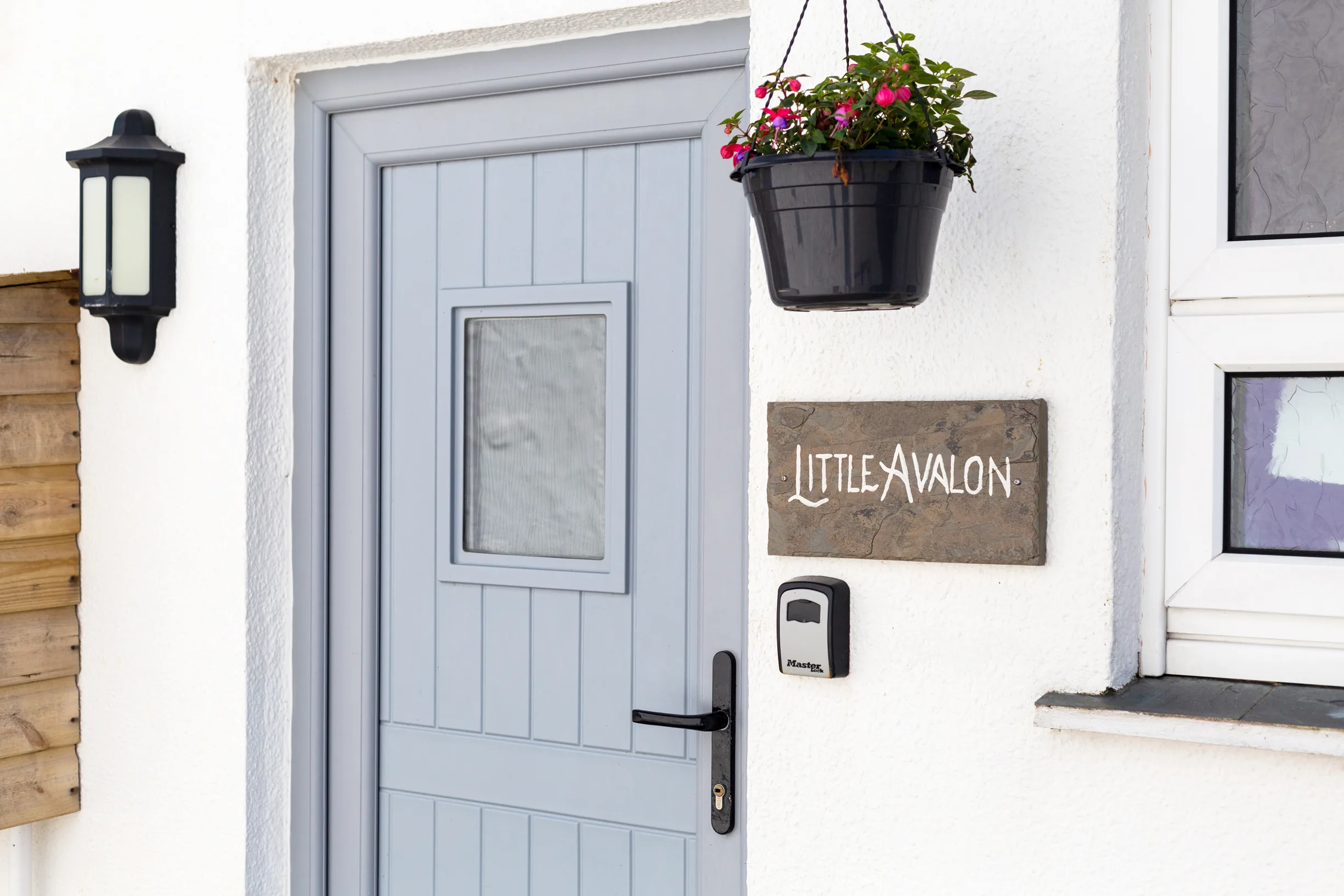Little Avalon front door with slate name plate.