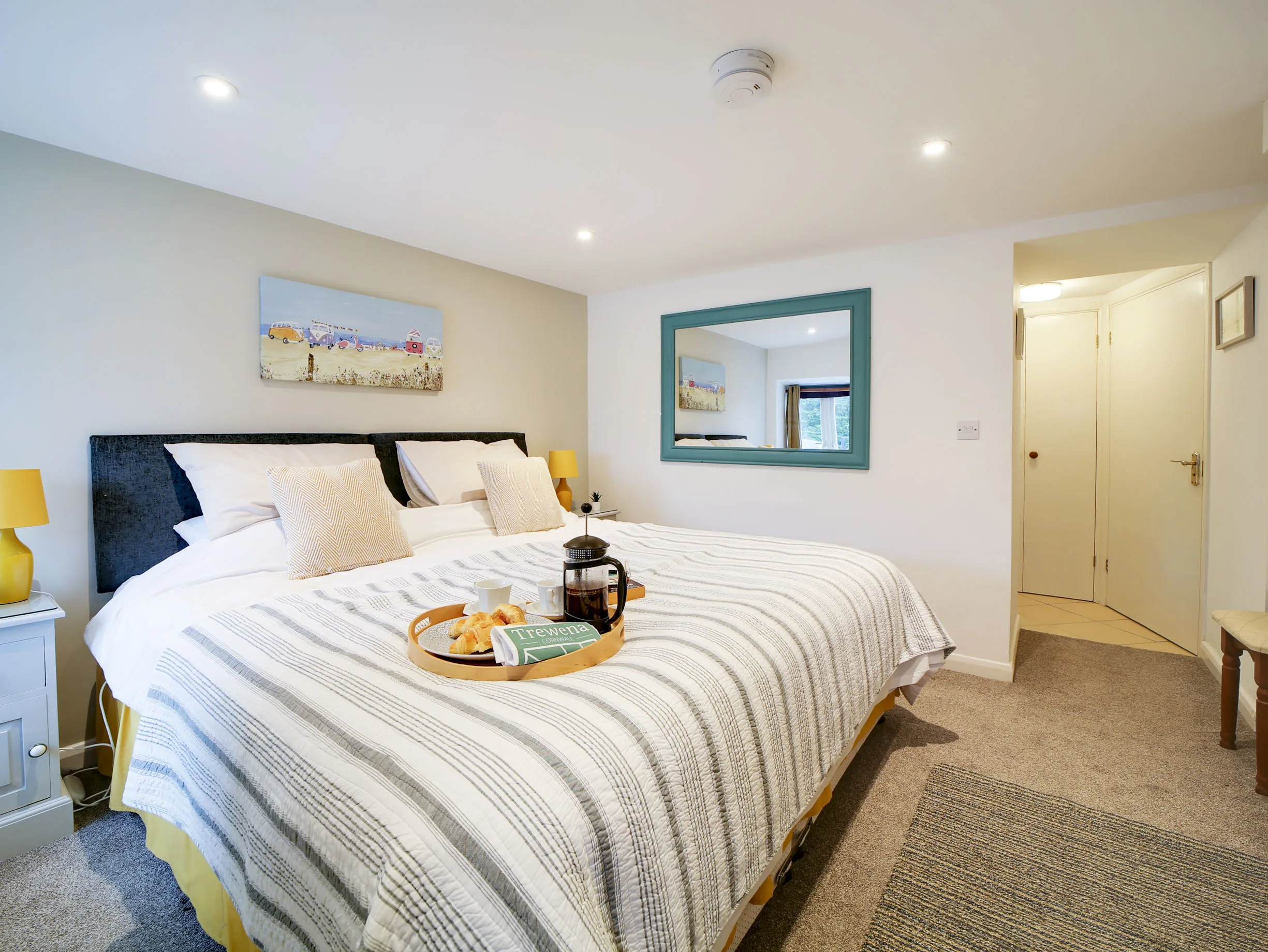 Super-king bed in the downstairs bedroom of The Pigsty.