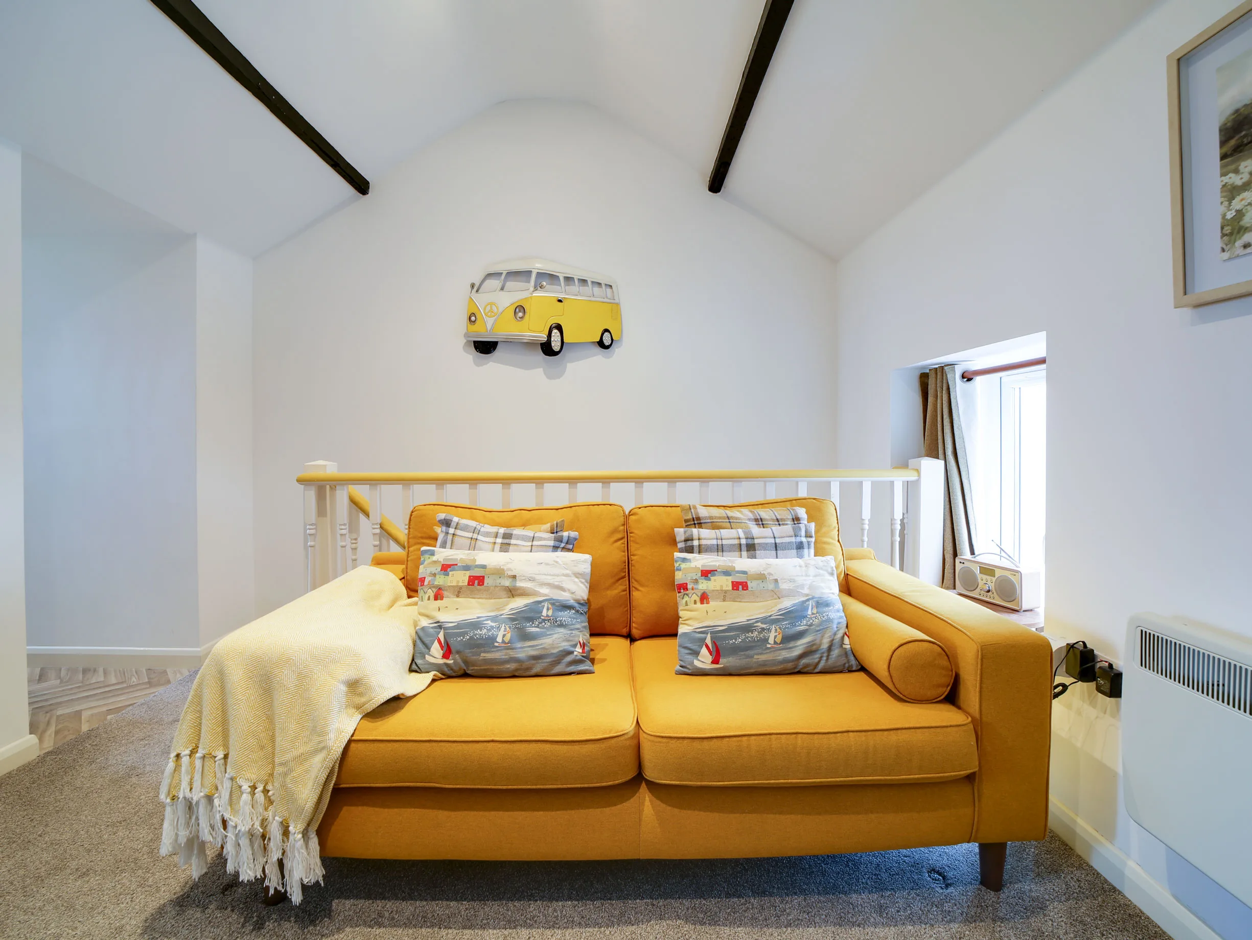 The Pigsty's mustard sofa upstairs.