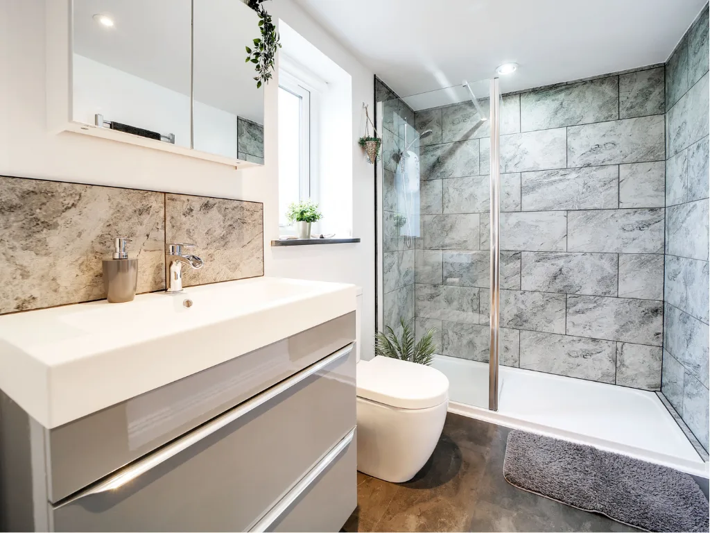 Tractor Shed bathroom. Walk-in shower with marble tiling, vanity unit.