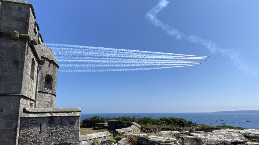 The Red Arrows performing an aerobatic display over Falmouth Bay, viewed from Pendennis Castle during Falmouth Week.