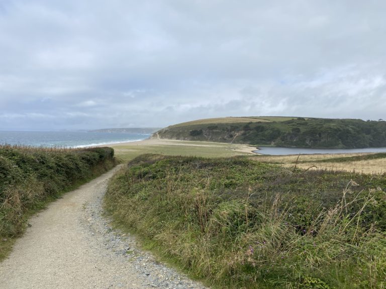 The approach to Loe Bar Beach with the ocean on one side and the lake on the other