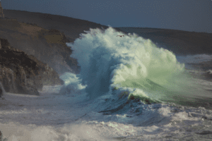 A huge storm wave hitting the coast