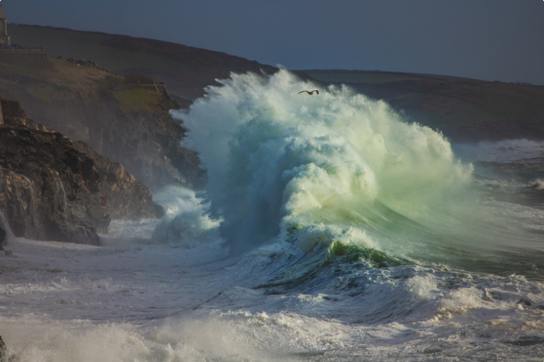 A huge storm wave hitting the coast
