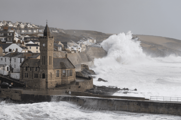 Huge storm waves crash into the sea wall at Porthleven in Cornwall